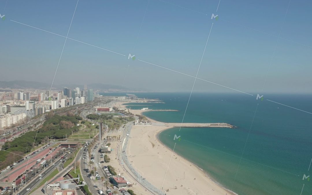 AERIAL: Drone Flight over Barcelona Beach on Beautiful Sunny Day with Blue Sky