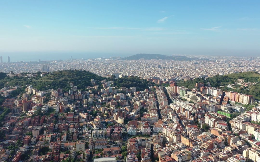 Aerial Stock Footage: Flying with Drone over City Barcelona in Spain | urban houses and streets | 4k